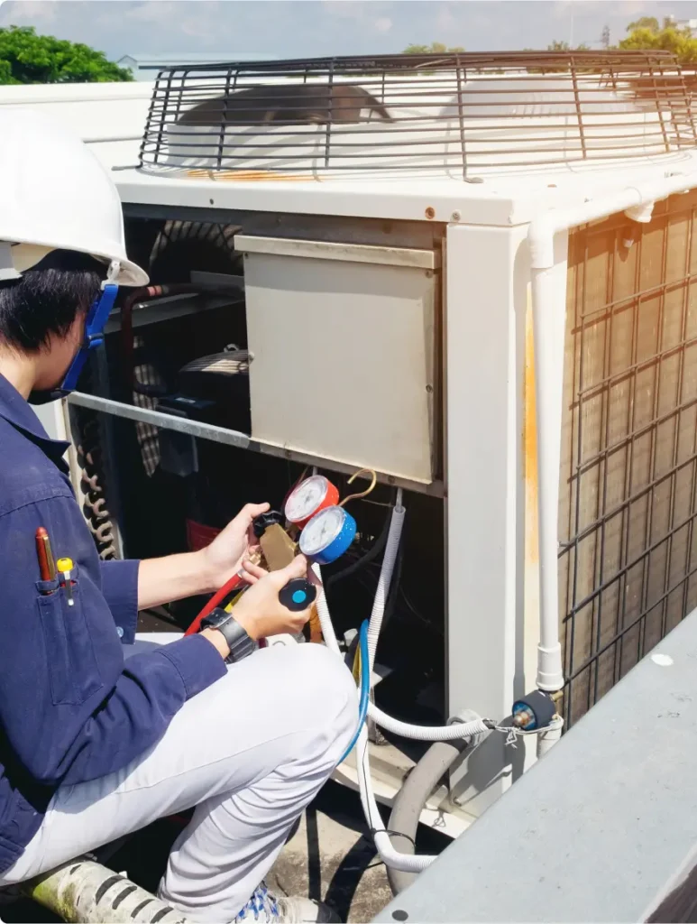 Technician inspecting HVAC system outdoors